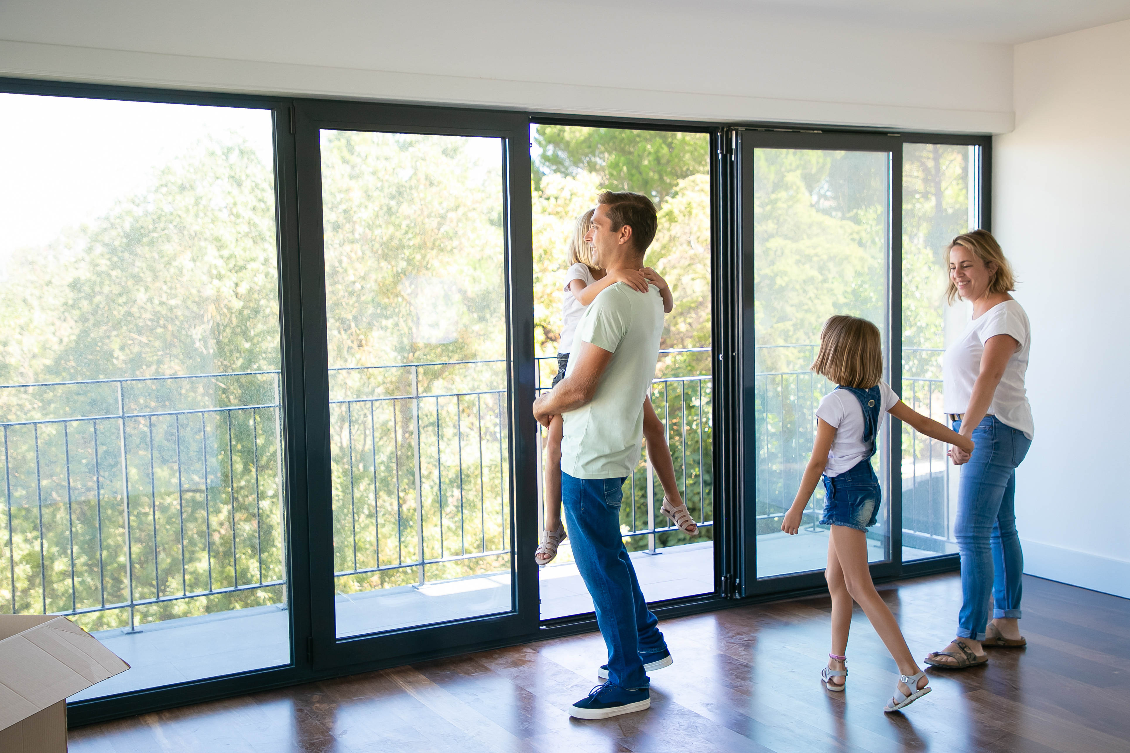 happy-father-with-daughter-standing-near-open-balcony-and-smiling happy-father-with-daughter-standing-near-open-balcony-and-smiling